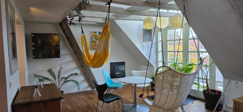 a room with a table and chairs in a room at Townhouse in the Center Free Parking in Aalborg