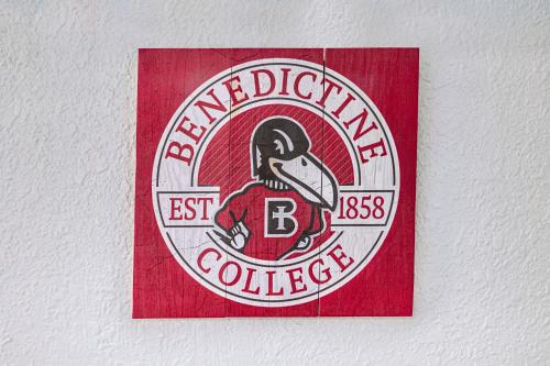 Un certificado, premio, letrero u otro documento en Awesome Benedictine Theme and In Your Budget!