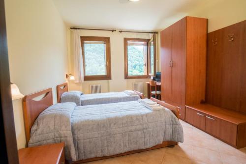 Un pat sau paturi într-o cameră la Colli Berici