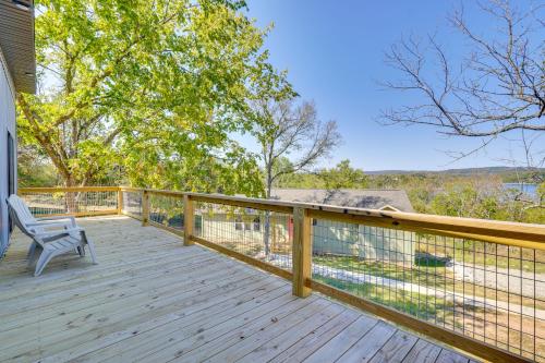 a wooden deck with a chair on it at Lake-View Retreat with Grill in Eagle Rock! in Eagle Rock