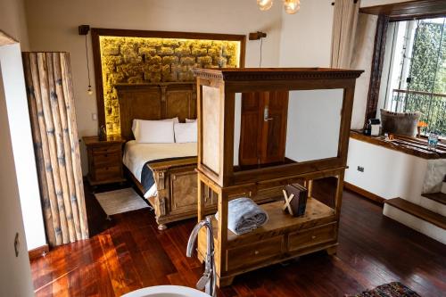 a bedroom with a bed and a large mirror at On Hotel Boutique in Sucre