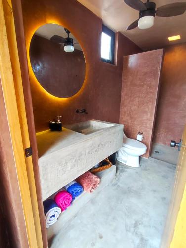 a bathroom with a sink and a toilet at Casa Nacui 1 in El Sargento
