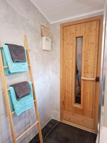 a room with two bunk beds and a door at Haus Lichtenberger in Saalfelden am Steinernen Meer
