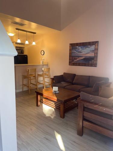 a living room with a couch and a table at Executive Suites in Winchester