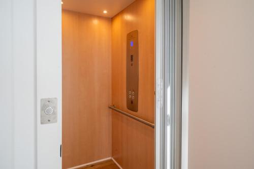 a door in a room with a doorframe and a hallway at Luxury New Build with Oceanview - Grow With The Flow in Carolina Beach