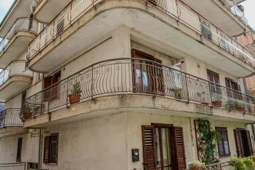 an apartment building with balconies and plants on it at MontagnaVivaCilento in Piaggine