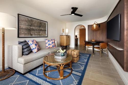 a living room with a couch and a table at Fairmont Kea Lani, Maui in Wailea