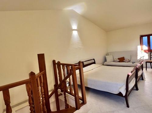 a small bedroom with a bed and a window at Il Vecchio Borgo in San Donato Val di Comino