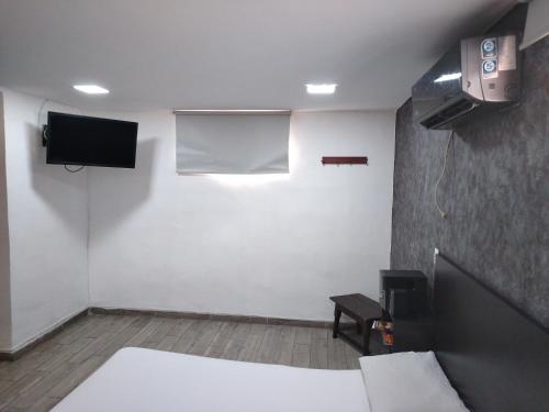 TV a/nebo společenská místnost v ubytování Hotel Medellin Park