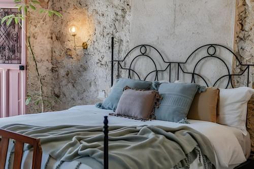 Ένα ή περισσότερα κρεβάτια σε δωμάτιο στο Casa Luz de Frida