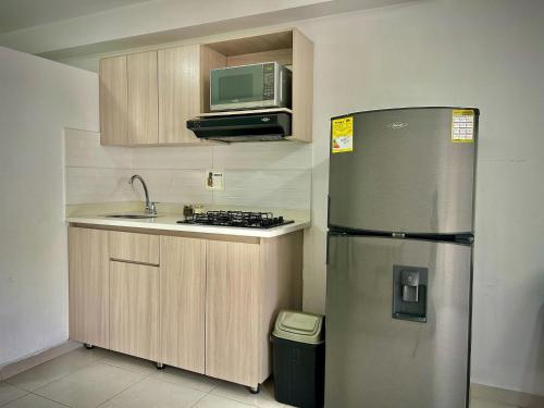 Η κουζίνα ή μικρή κουζίνα στο Apartamentos y Loft Laureles