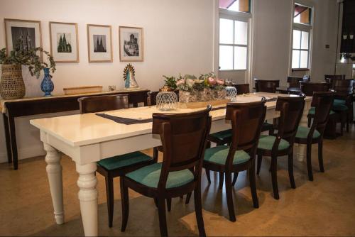 a large dining room with a table and chairs at Real Hotel Luján in Luján