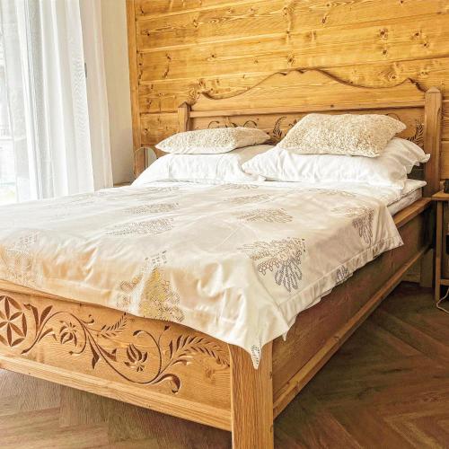 Postel nebo postele na pokoji v ubytování NOWE APARTAMENTY GÓRALSKIE BIAŁKA - Sauny, Bania - w cenie