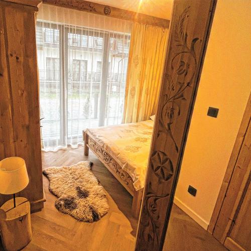 Postel nebo postele na pokoji v ubytování NOWE APARTAMENTY GÓRALSKIE BIAŁKA - Sauny, Bania - w cenie
