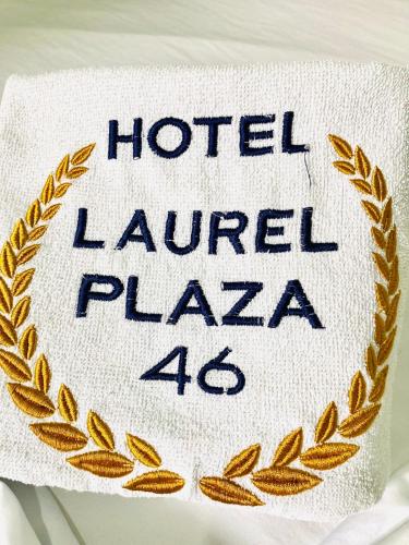 a towel with the words hotel laurel plaza on it at Laurel plaza 46 in Montería