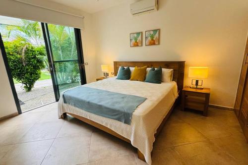 Postel nebo postele na pokoji v ubytování Louisa Apart-Hotel Las Ballenas