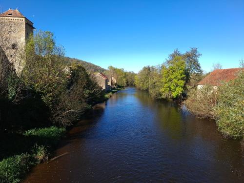 a view of a river from a bridge at Studio Zoé in Saint-Père