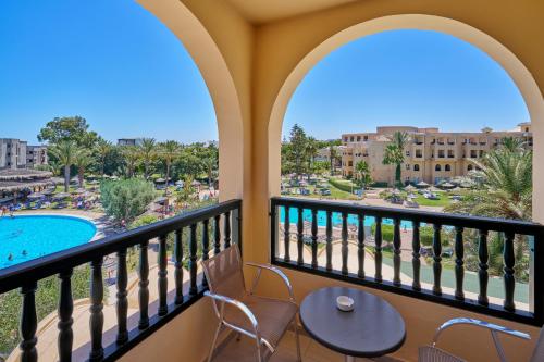 a balcony with a view of the pool and resort at TUI SUNEO Royal Kenz - All Inclusive in Port El Kantaoui