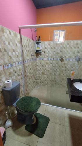a bathroom with a toilet and a sink at Sitio Santo Antonio in Tutóia