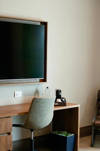 TV a/nebo společenská místnost v ubytování Moka Boutique Hotel