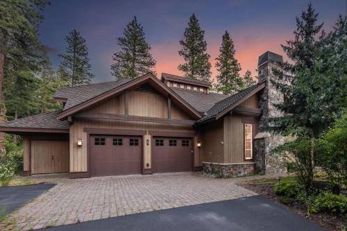 a large house with a garage at New! Luxurious Timber-Frame Retreat with Hot Tub, Fire Pit, and Gourmet Kitchen in Cle Elum