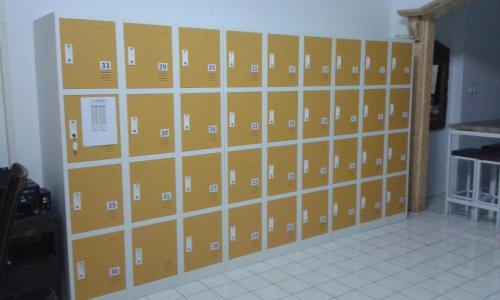 a room with a bunch of boxes on a wall at Pondok Heras Suite in Jakarta