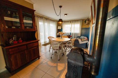 a kitchen with a table and a dining room at Rancho P&R in Balsa Nova
