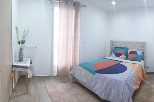 Ένα ή περισσότερα κρεβάτια σε δωμάτιο στο Les Suite Appartement à Chalon sur Saône