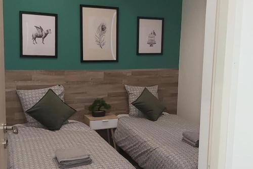 Ένα ή περισσότερα κρεβάτια σε δωμάτιο στο Les Suite Appartement à Chalon sur Saône
