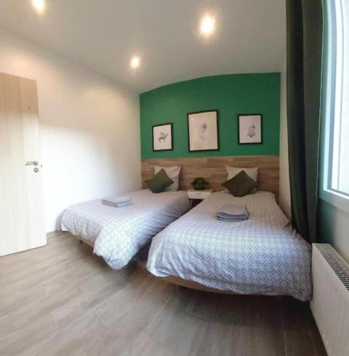 Ένα ή περισσότερα κρεβάτια σε δωμάτιο στο Les Suite Appartement à Chalon sur Saône