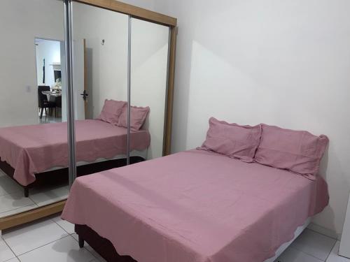 Postel nebo postele na pokoji v ubytování Casa por temporada