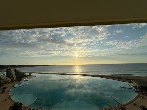 a view of the ocean from a swimming pool at San Alfonso del Mar la mejor vista de Algarrobo in Algarrobo