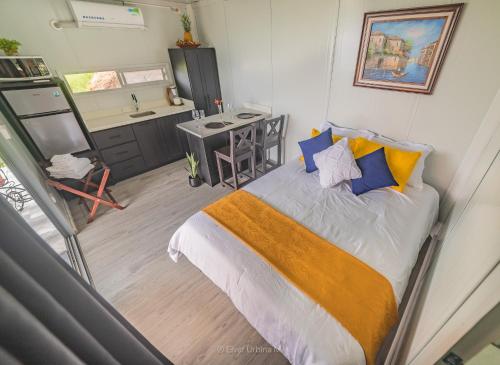 Ένα ή περισσότερα κρεβάτια σε δωμάτιο στο Dadirri Cozy House Santa Elena Monteverde