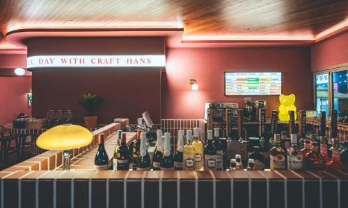 a bar with a bunch of bottles on a counter at Wonju City Hotel HYEOKSIN in Wonju