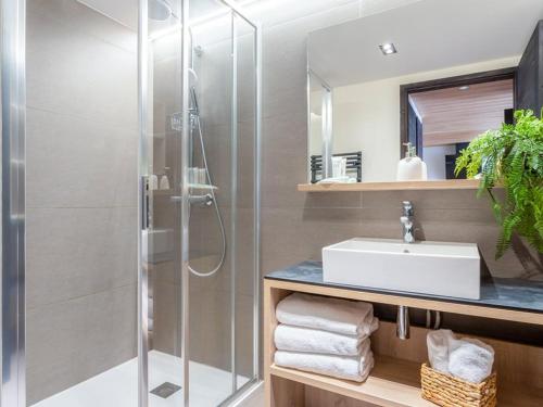 a bathroom with a shower and a sink at Appartement de luxe aux Saisies avec SPA et parking pour 6 personnes - FR-1-810-16 in Les Saisies