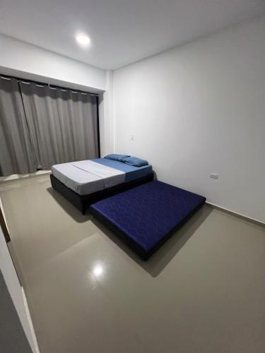 Ένα ή περισσότερα κρεβάτια σε δωμάτιο στο Casa campestre guamal 29