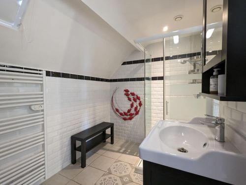 a white bathroom with a sink and a shower at Chambres avec table d'hôtes en Berry, proche Zoo de Beauval, parking - FR-1-591-706 in Fontguenand