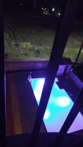 an overhead view of a pool at night at SV Inns Sea Pearl in Devgarh
