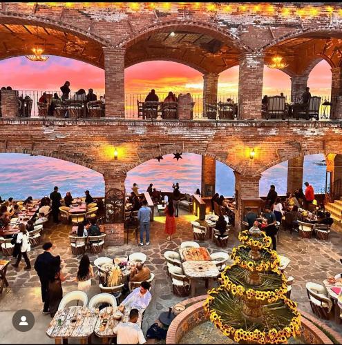 a group of people sitting at tables in a building at Luxury, Ocean View, Pool, Jacuzzi, Valle de Guadalupe, Los Portales De Garcia, Splash, Encanto Restaurants, Surf Breaks in Primo Tapia, Rosarito in Rosarito