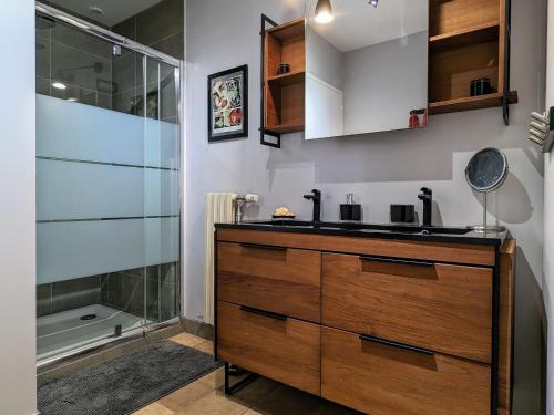 a bathroom with a sink and a shower at Ferme de charme avec piscine et tennis privés - FR-1-582-496 in Saint-Romain-Lachalm