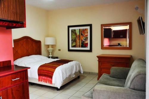 Ένα ή περισσότερα κρεβάτια σε δωμάτιο στο Hotel Boutique Los Arcos
