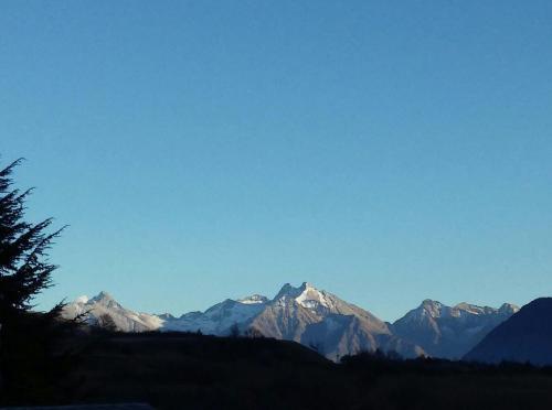 a view of a mountain range with snow covered mountains at Les Vrais Rayons in Verrayes