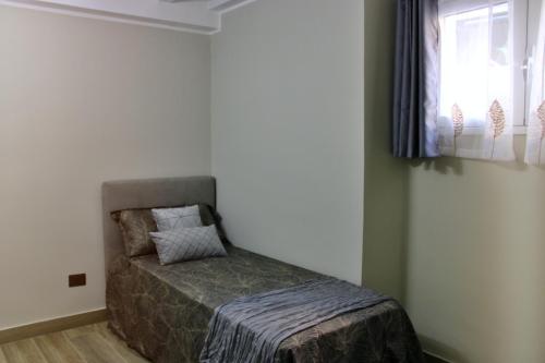 Katil atau katil-katil dalam bilik di Keope Urban Suite