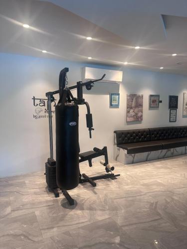 a room with a gym with a exercise machine at Tajh Pool Villas in Chalong 