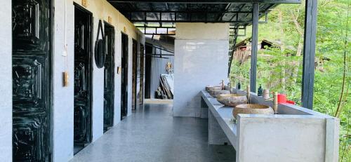 a hallway of a building with a row of sinks at Du peak home in Làng Cac