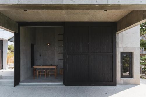 an open door of a house with a table at momo in Kirabaru