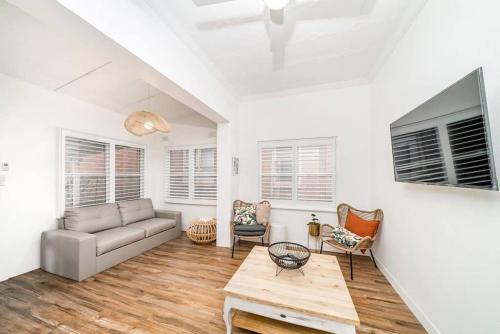 a living room with a couch and a table at Peters Rest Central Wagga in Wagga Wagga