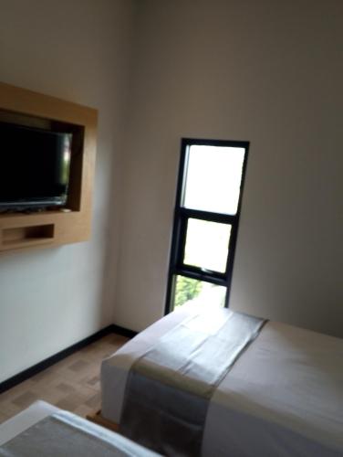 Katil atau katil-katil dalam bilik di Grand Plaza Suites
