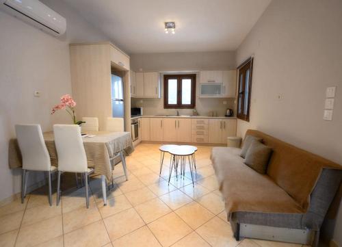 a living room with a couch and a table at Serenity Haven in Kalymnos