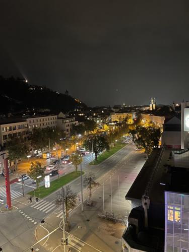 a night view of a city with a parking lot at Zentrale Wohnung in Graz SOVA 2 in Graz